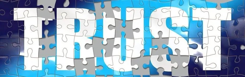 Puzzle pieces with blue and white background, representing collaboration and problem-solving in digital music and media indus