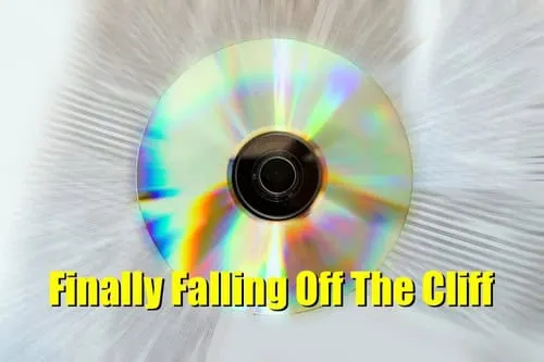 CD/DVD disc with colorful reflections, titled "Finally falling off The Cliff".