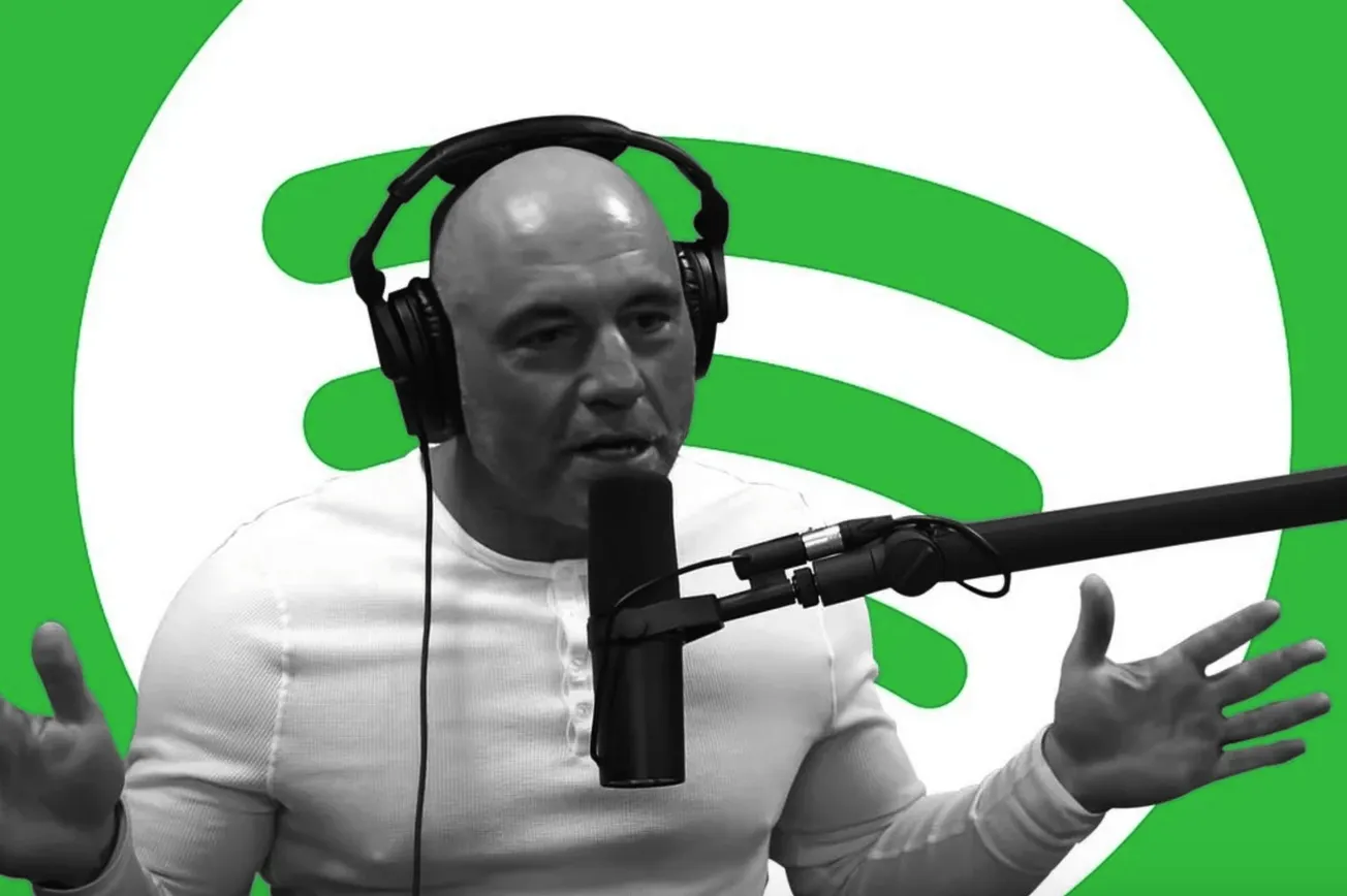 Bald man speaking into a microphone with headphones against a green Spotify logo background, representing music streaming, po