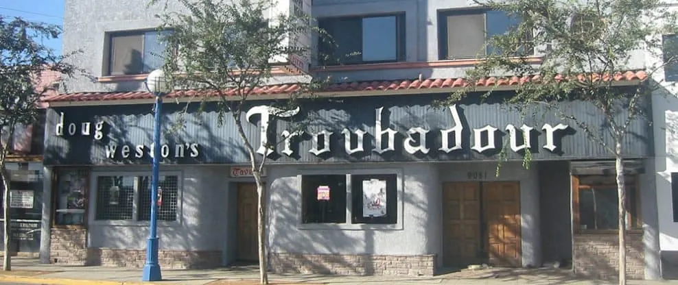 Dog weston's Troubadour bar outdoor signage, live music venue in Hollywood urban setting, popular nightlife spot for entertai