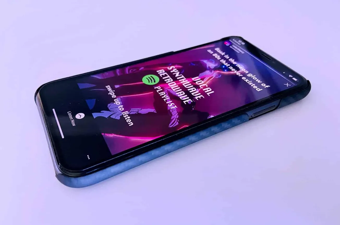 AI-powered music streaming app on smartphone with neon-themed interface, highlighting digital music, playlists, and personali