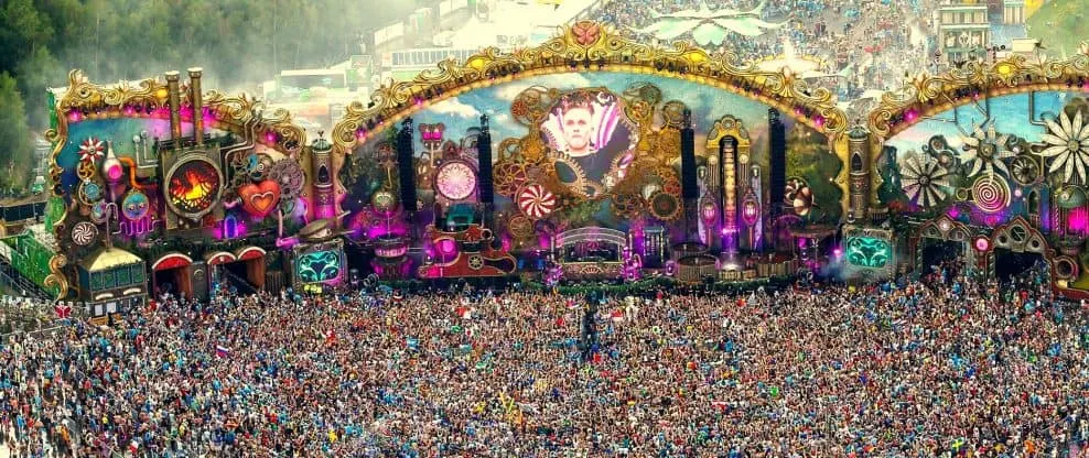 Carnival music festival stage with vibrant lights and large crowd, showcasing electronic dance music, festival entertainment,