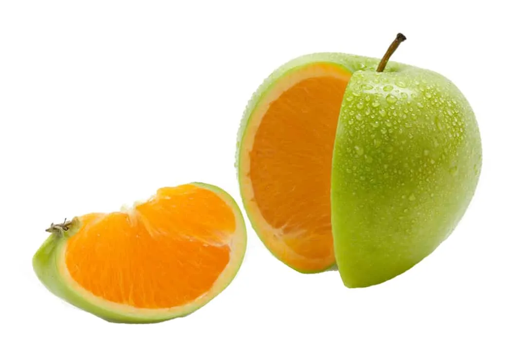 Fresh green apple with a slice of juicy orange inside, water droplets on the surface, highlighting healthy fruit and vibrant