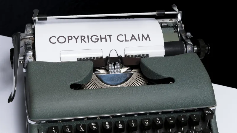 Copyright claim typewriter representing intellectual property rights and copyright protection concepts in the music and enter