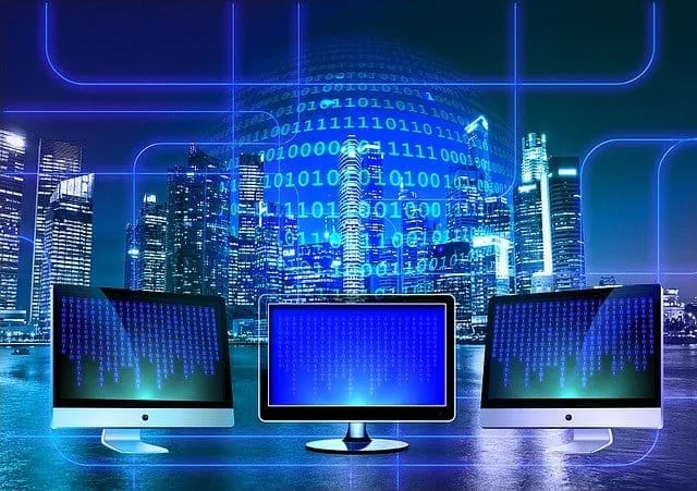 Cryptocurrency digital trading computers with binary code and city skyline at night.