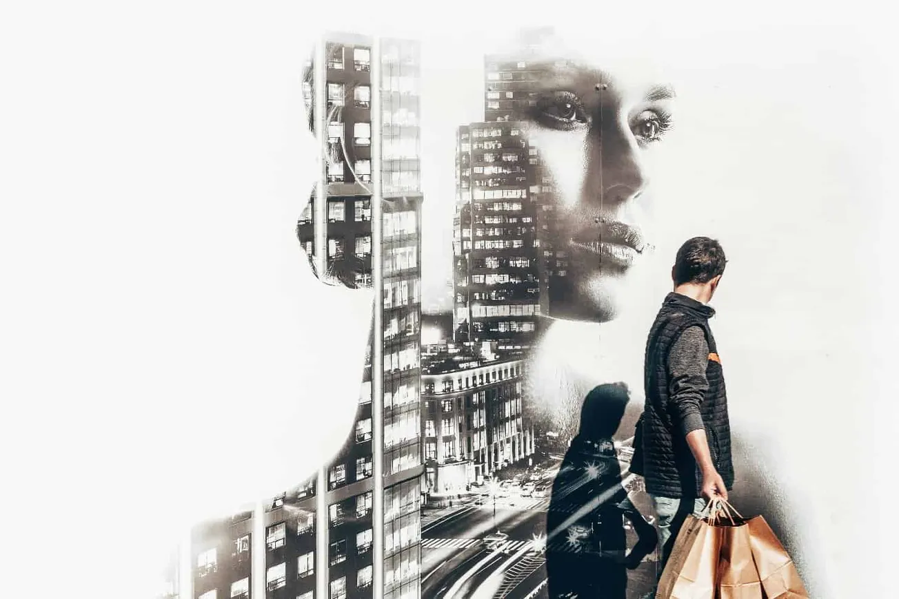 Futuristic cityscape overlayed with a woman's face, representing urban life, modern technology, and connectivity aspects for