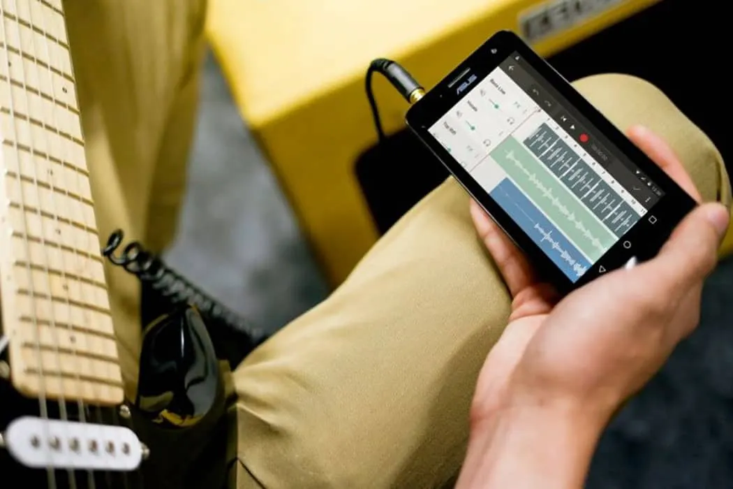 Music production app on smartphone for creating beats and music tracks.