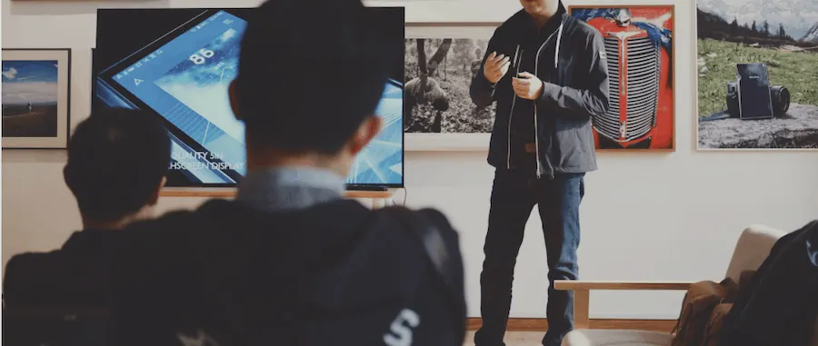 Hypebot digital marketing presentation, startup pitch, or music industry seminar in an office or gallery setting with attende