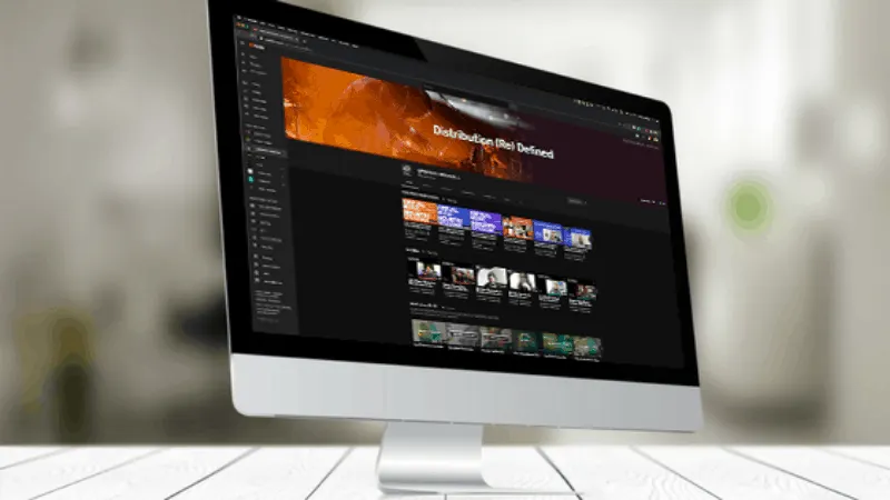 SEO-friendly stock video editing software interface on a sleek iMac demonstrating digital content creation for music industry