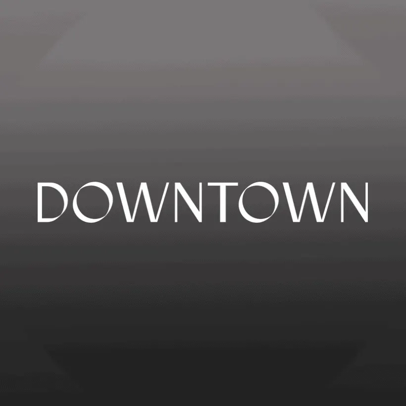 Downtown cityscape in black and white with modern architectural buildings and vibrant nightlife atmosphere.