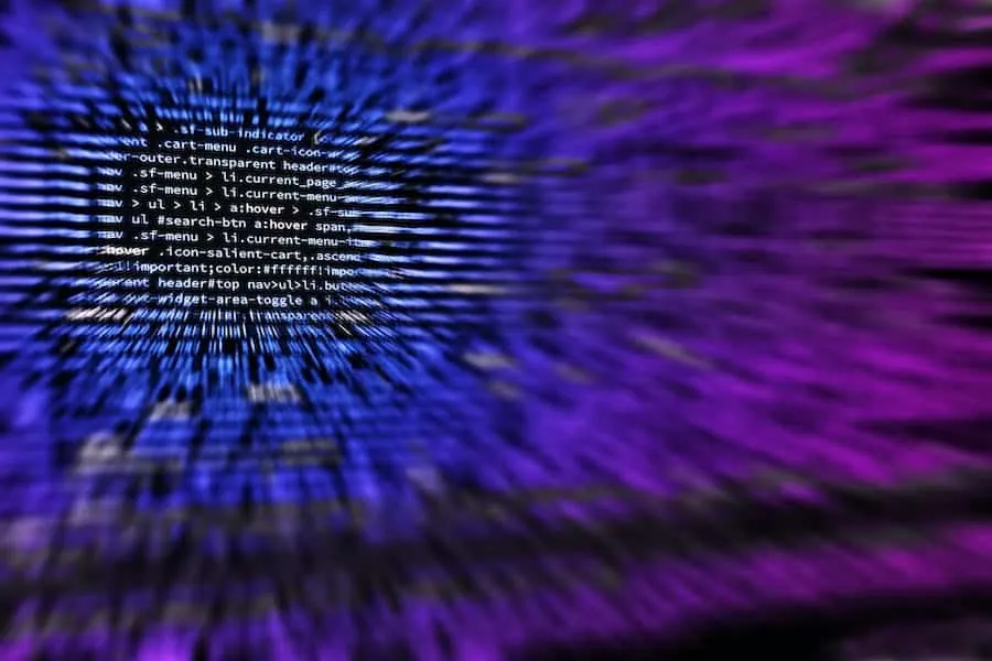 Online code snippet with digital text in blue and purple hues, representing data processing and technology themes for music i