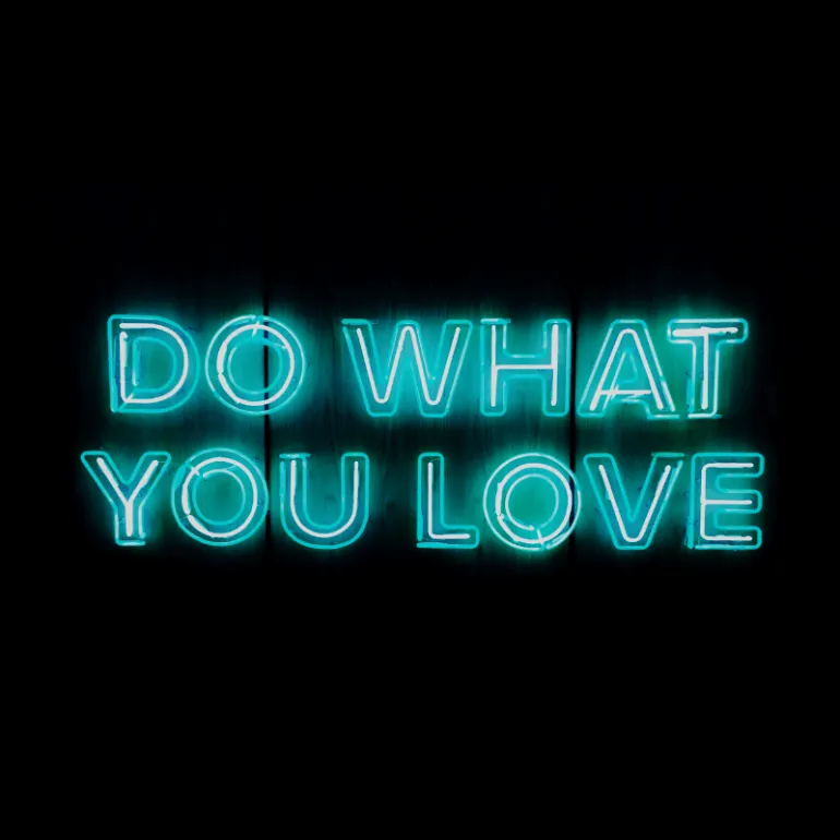 Do what you love neon sign motivational quote inspiring creativity and passion for pursuing your dreams.