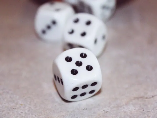 Dice, gaming, chance, gambling, casino, board game, tabletop, entertainment, luck, number six, black dots on white background