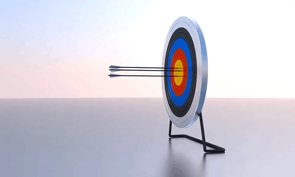 Target with three arrows hitting the bullseye on a darts board for marketing and advertising success.
