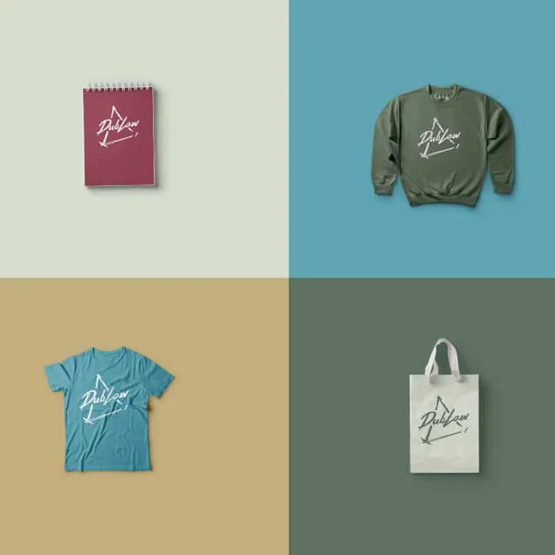 Bold merchandise items featuring the Dublow logo, including notebook, sweatshirt, t-shirt, and tote bag, showcasing trendy br