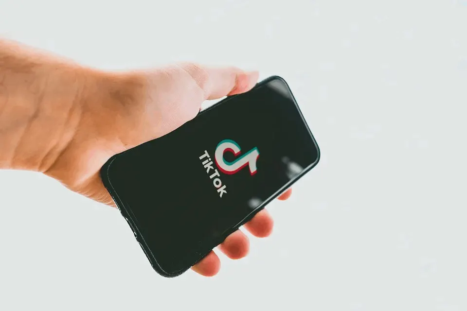 TikTok logo displayed on a smartphone screen, representing popular social media platform for short videos and digital content