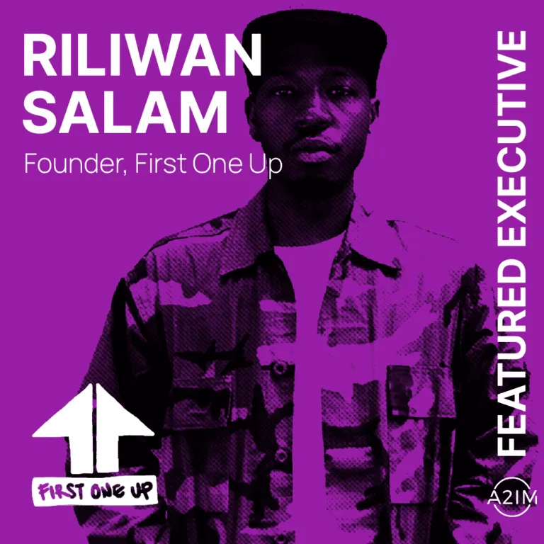 Riliwan Salam, founder of First One Up, featured as an executive in a vibrant purple-toned image highlighting leadership and