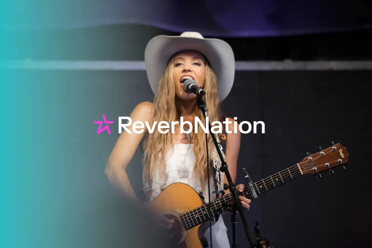 Girl playing acoustic guitar live music performance at concert stage with ReverbNation branding, female singer-songwriter wit
