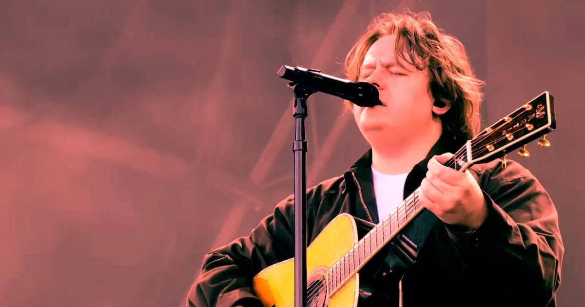 A young musician passionately singing and playing acoustic guitar at a live performance, capturing the essence of indie and s