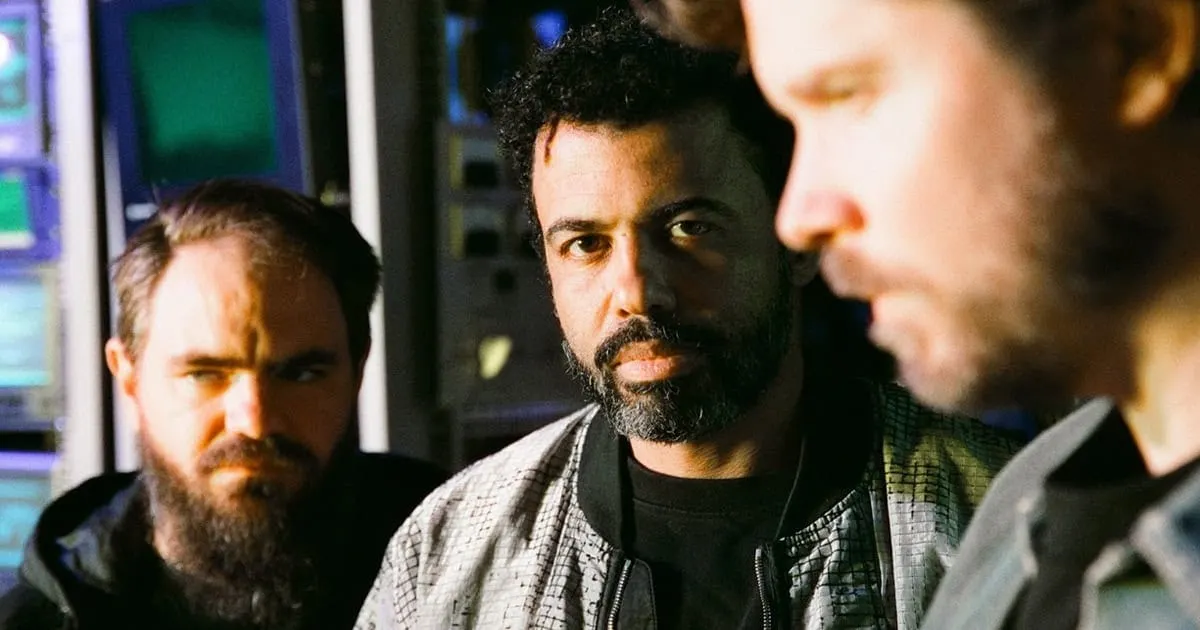 - Diverse group of young professionals in a music studio, collaborating on music production and sound engineering, emphasizin