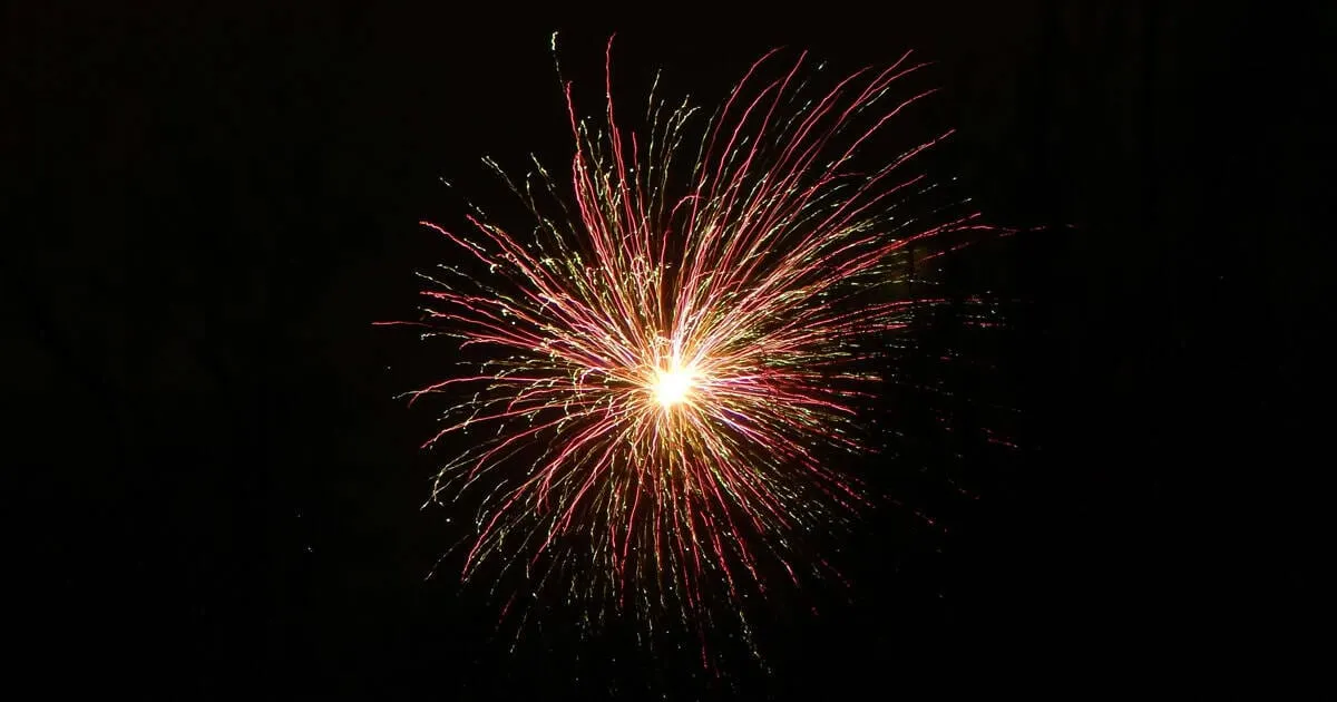 Bright fireworks explosion lit up the night sky, creating a colorful display for celebration and entertainment. Perfect for e