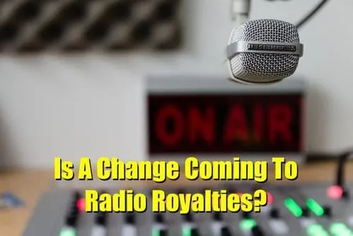 Microphone in a radio studio with an "ON AIR" sign and on-air equipment, representing radio broadcasting and the potential ch
