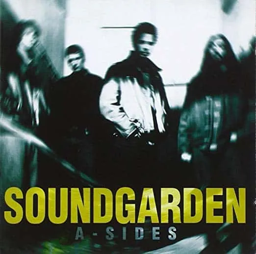 Soundgarden band members in a moody, blurred black and white photo for the album "A-Sides" promoting grunge music fans and al