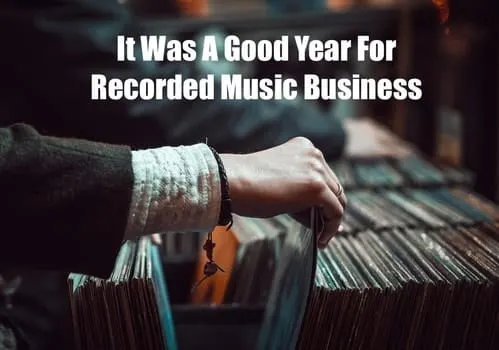 Vintage vinyl record collection at a record store, highlighting the rise in recorded music sales and success of the music ind