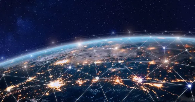 Global connectivity and digital networking illustration from space, showing Earth with illuminated cities connected by a netw