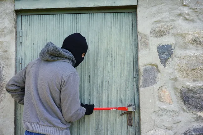 Broken door lock with crowbar, vandalism, theft, urban crime, destruction of property, criminal activity, security breach, il