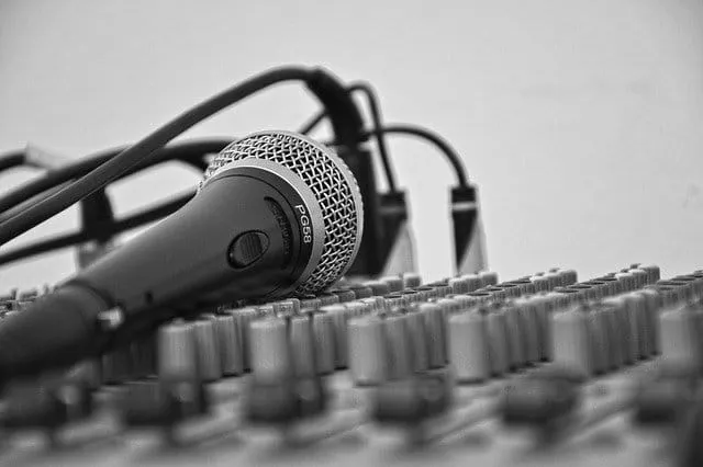 Professional audio microphone and music mixer setup for recording and sound engineering.