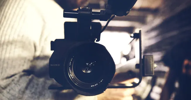 DSLR camera mounted on stabilizer rig for professional video recording and content creation.