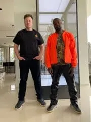 Young man and man standing in modern indoor space, casual fashion, diverse background, urban style, lifestyle photography, Hy