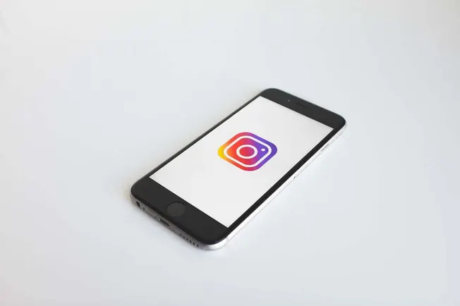 Instagram logo displayed on a smartphone screen, highlighting social media marketing and digital branding strategies.