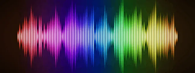 Vibrant rainbow-colored sound wave visualization on a dark background, representing music, audio, or digital sound concepts s