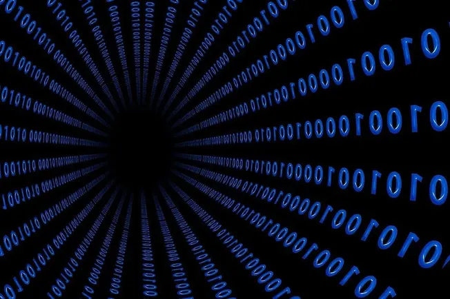 Binary code tunnel representing digital music and online entertainment trends.