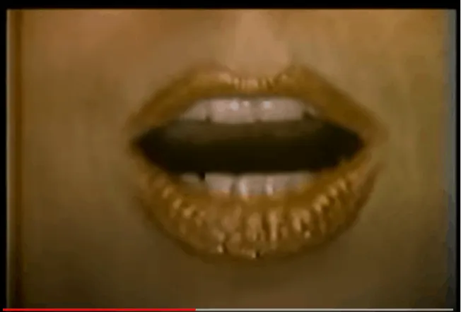 Gold lipstick on lips with black lipstick in the middle, close-up of mouth, fashion, beauty, bold makeup, lip makeup, high fa