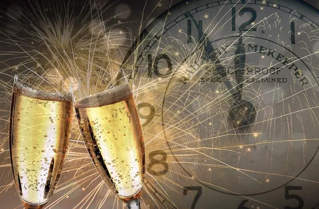 Celebration with champagne toasting, fireworks, and New Year's clock counting down for festive event or special occasion.
