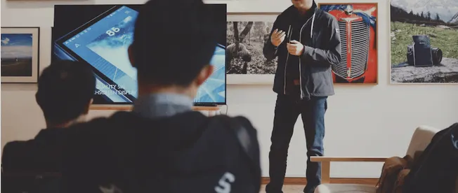 Hypebot digital marketing presentation, startup pitch, or music industry seminar in an office or gallery setting with attende