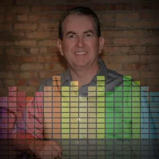 Brightly colored audio equalizer overlay on a smiling man against brick wall background, representing music streaming, digita