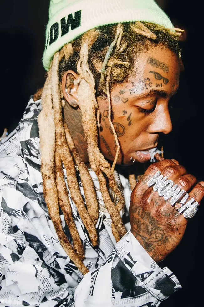 Dreadlocked rapper with tattoos and a beanie, smoking a cigar, wearing a newspaper print jacket, showcasing hip-hop culture,