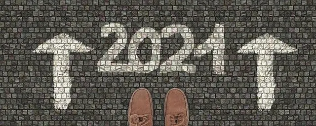 Innovative chalk art of "2024" with upward arrows on cobblestone sidewalk symbolizing new beginnings and forward-looking tren
