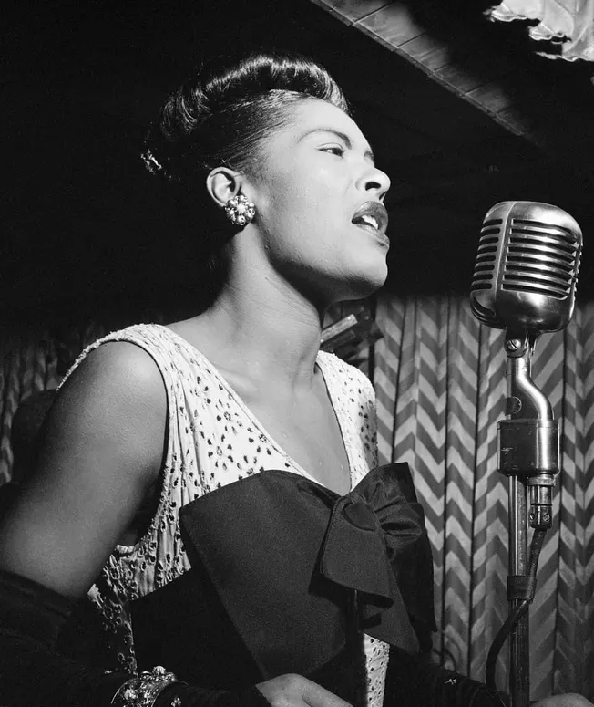 Elegant female jazz singer performing with vintage microphone, black and white photo capturing soulful music, classic look, a