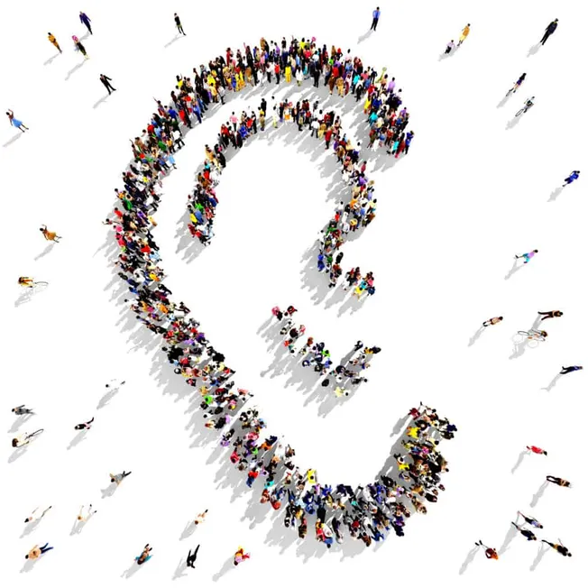 Crowd of people forming a question mark symbol, representing curiosity and inquiry in music industry questions and trends, di