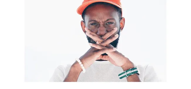 Innovative music industry professional wearing orange safety helmet, contemplating, reflecting on music business trends and t