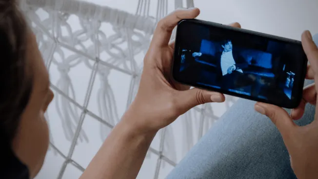 Hypebot person recording concert on smartphone, music industry, concert footage, digital media, music marketing, live music s