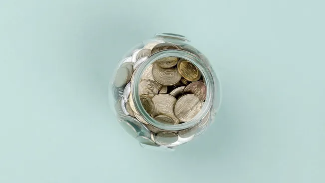 Jar filled with coins on pastel background, saving, financial growth, money management, investmentfinance, business, cryptocu