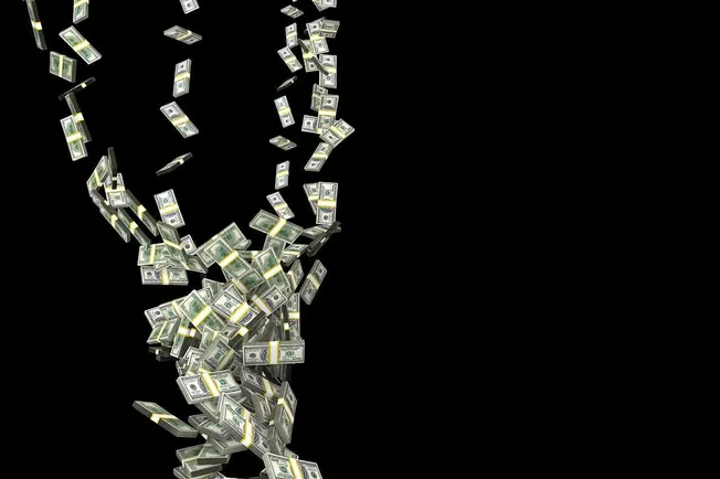 Stacks of US dollar bills falling, representing wealth, money flow, or financial success.