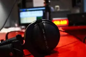 Headphones on mixing console in music studio, professional audio equipment for music production, Hypebot music industry insig