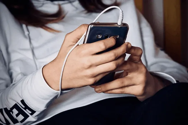 People using smartphone with earphones, social media, digital content, modern technology, entertainment, communication, wirel